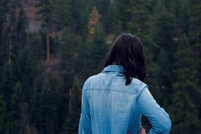 backview of girl in a blue jacket