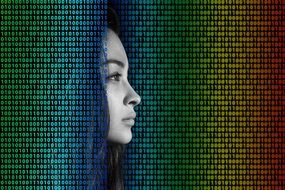 profile portrait of a woman on a binary codes background