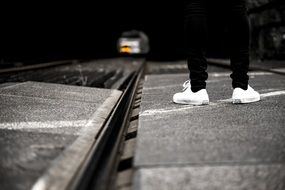 Person is standing near railway