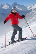 skier in a red jacket and helmet on snow mountain