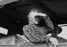 Black and white photo of the old woman in the automobile
