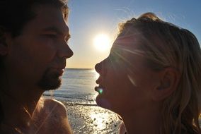 Couple on a beach at the sunset