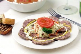 beef with vegetable salad on a plate for dinner