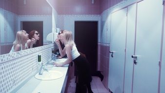 girls painted in the toilet