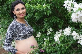 happy woman in flowering spring garden