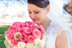 Happy bride holding a Wedding bouquet