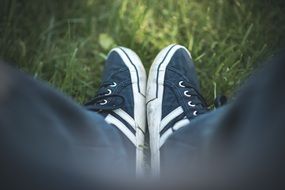 running shoes on green grass