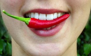 chili pepper in the mouth