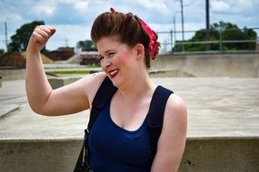 smiling Woman posing with folded hand up outdoor
