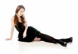 Caucasian Young girl in black clothe at white background