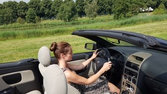 girl driving a convertible