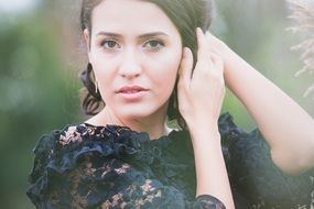 portrait of a brunette in a lace dress