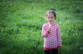 girl in pink with dandelion