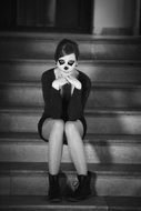 woman with unusual makeup on the steps