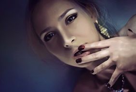 portrait of a beautiful woman with red nails