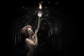 mystical photo of a girl in the dark