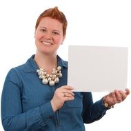 woman with short red hairs holding whiteboard