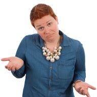 doubting woman with short red hairs