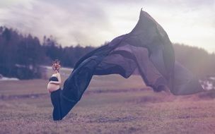 Pregnant Woman in mask posing outdoor