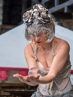 grey haired Woman with Magic Ball on hand