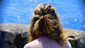 woman near the water on a sunny day