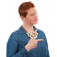 pointing woman with short red hairs