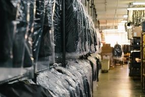 many men's suits in warehouse