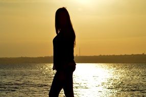 Silhouette of the woman near the ocean