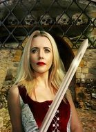 Portrait of strong female holding a weapon