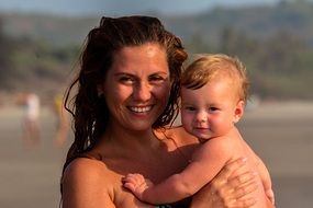 mother with baby near the river