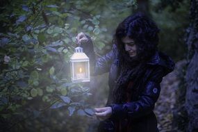 girl with a lantern in the garden