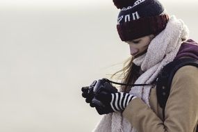 girl with a camera in winter
