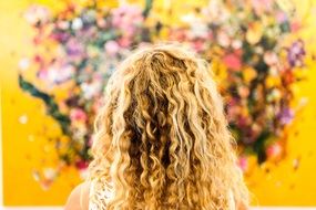 hair on a female head on a background of flowers