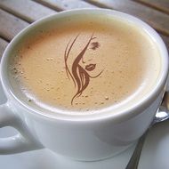 silhouette of a beautiful girl on coffee foam