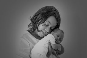 black and white portrait of mother with baby