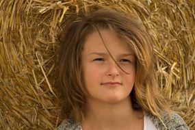 girl portrait in a haystack