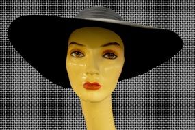 Black hat on a woman doll head