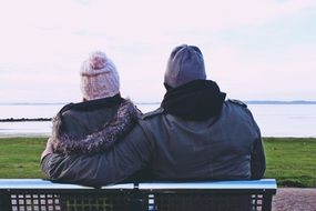 hugging couple on the bench
