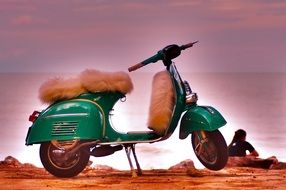 green scooter with a fur seat