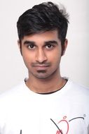 Young dark haired Man in white shirt, portrait