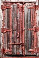 wooden door of the old barn close up