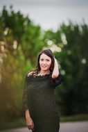 attractive woman posing in black dress