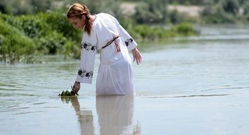 girl in a white dress in the water