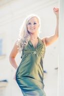 photo of the blonde in green dress