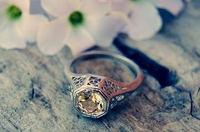 old ring with yellow stone