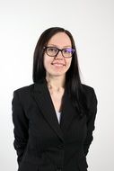 smiling girl in glasses and a business suit