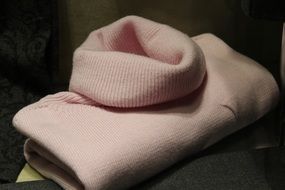 pink women's sweater in a shop