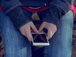 young person with Iphone 6S Plus