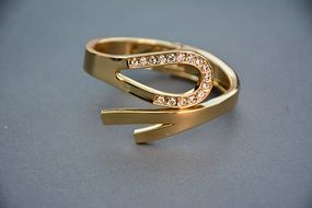 Shining ring with precious stones as a female jewelry