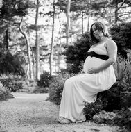 pregnant woman among nature in black and white image